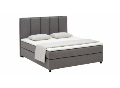 Kontinentālais "Boxspring" divguļamais gultas korpuss pārklāts ar dubultu ādu un tekstilu.