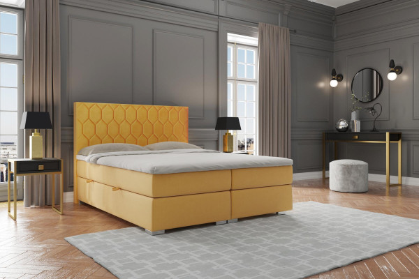 Boxspring gulta viesnīcai divguļamā forma ar luksusa matračiem, polsterētas funkcijas un dzelteno samtu.